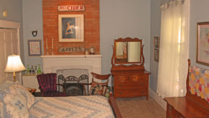 Antique oak furniture in 1870s room