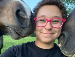 Horses kiss Carolyn