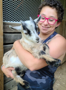 Carolyn holding pygmy goat