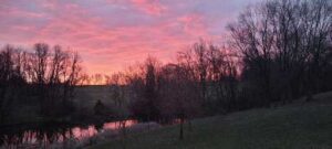 pink sunrise over First Farm Inn pasture